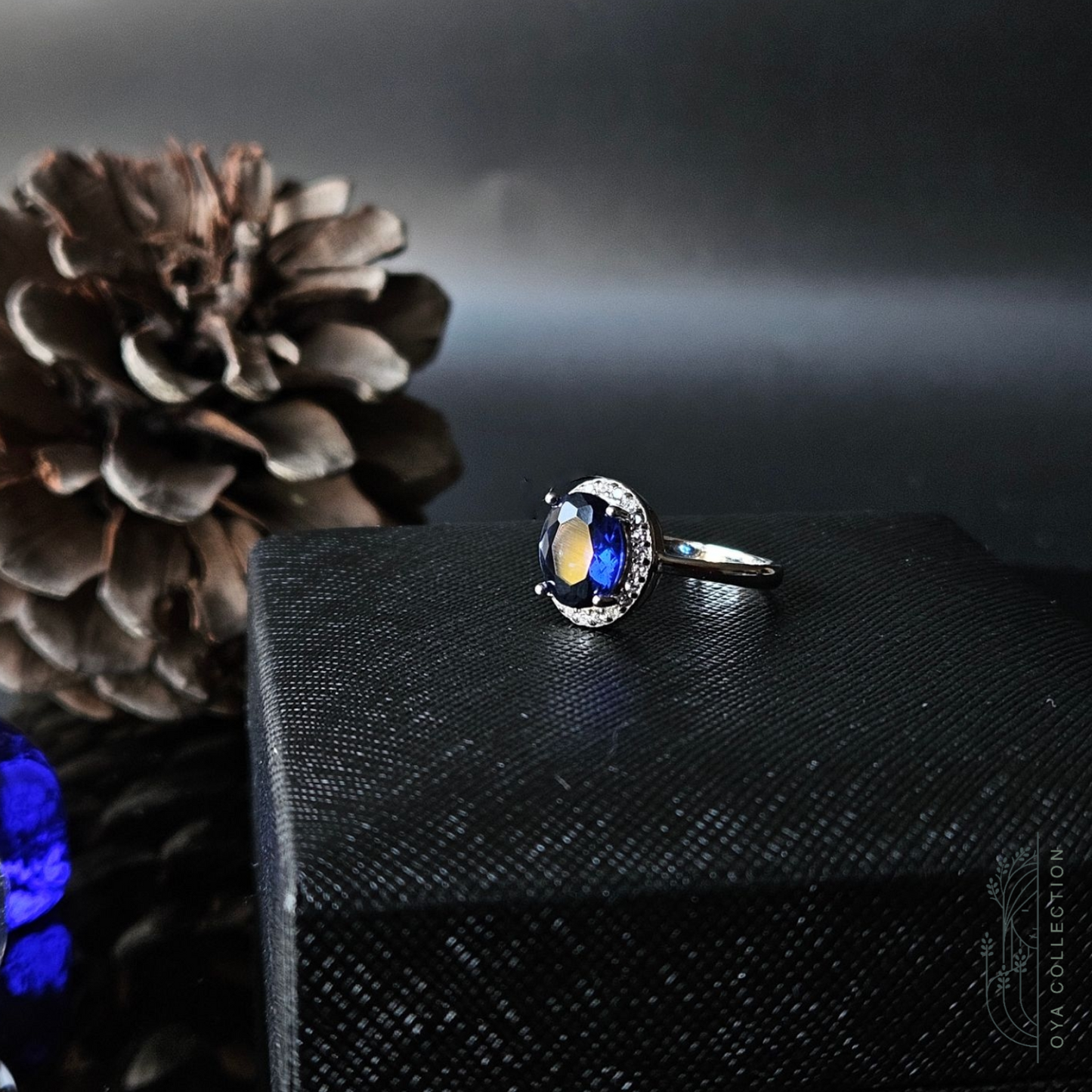 Sterling silver ring 925, medium size Oval shaped Blue Sapphire stone and zirconia all lined with Zirconia frame