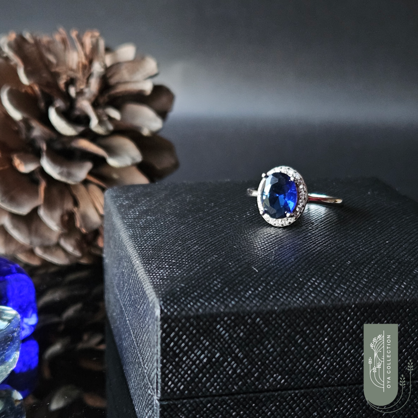 Sterling silver ring 925, medium size Oval shaped Blue Sapphire stone and zirconia all lined with Zirconia frame