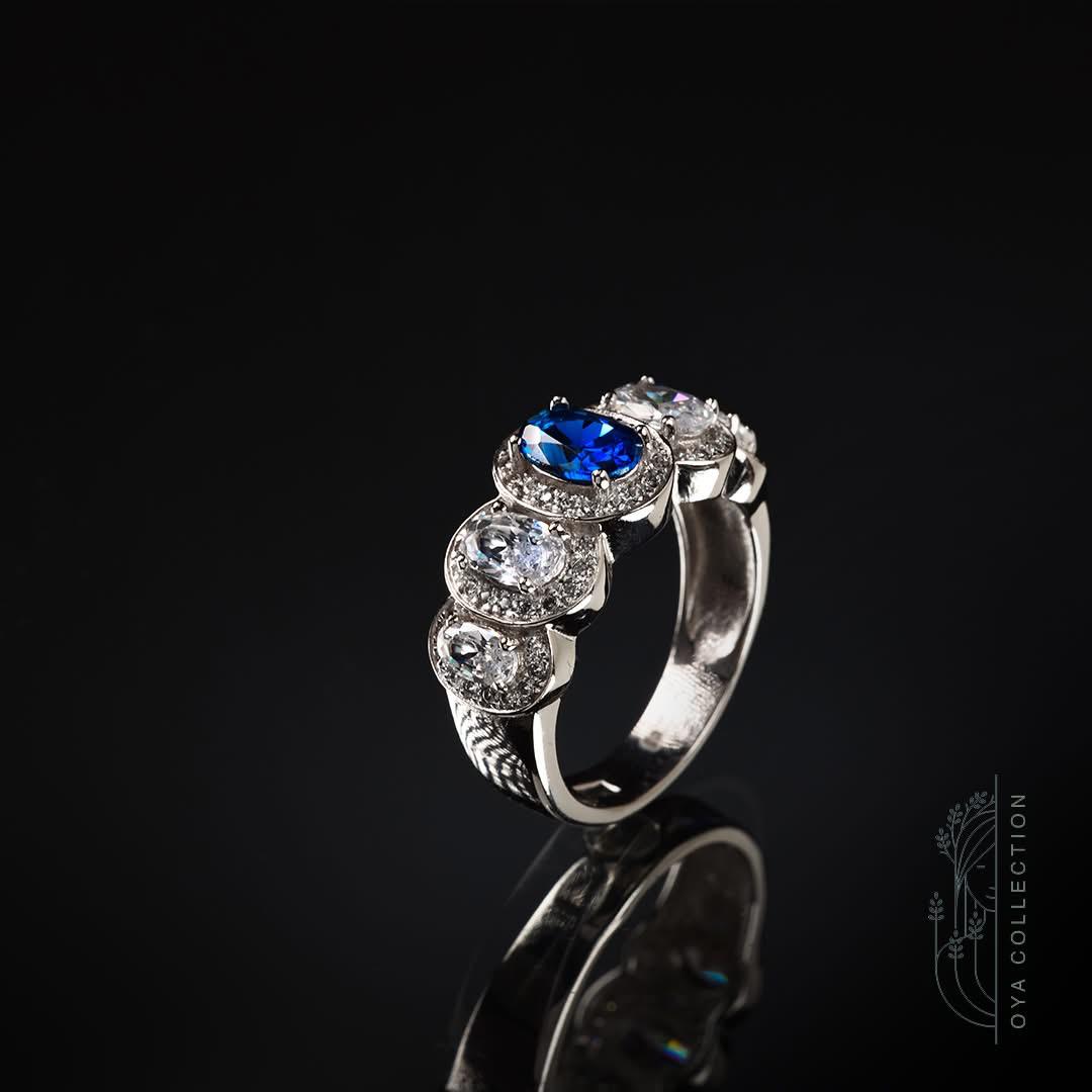 Sterling silver ring 925, 5 stones Oval shaped Blue Sapphire stone and zirconia all lined with Zirconia frame