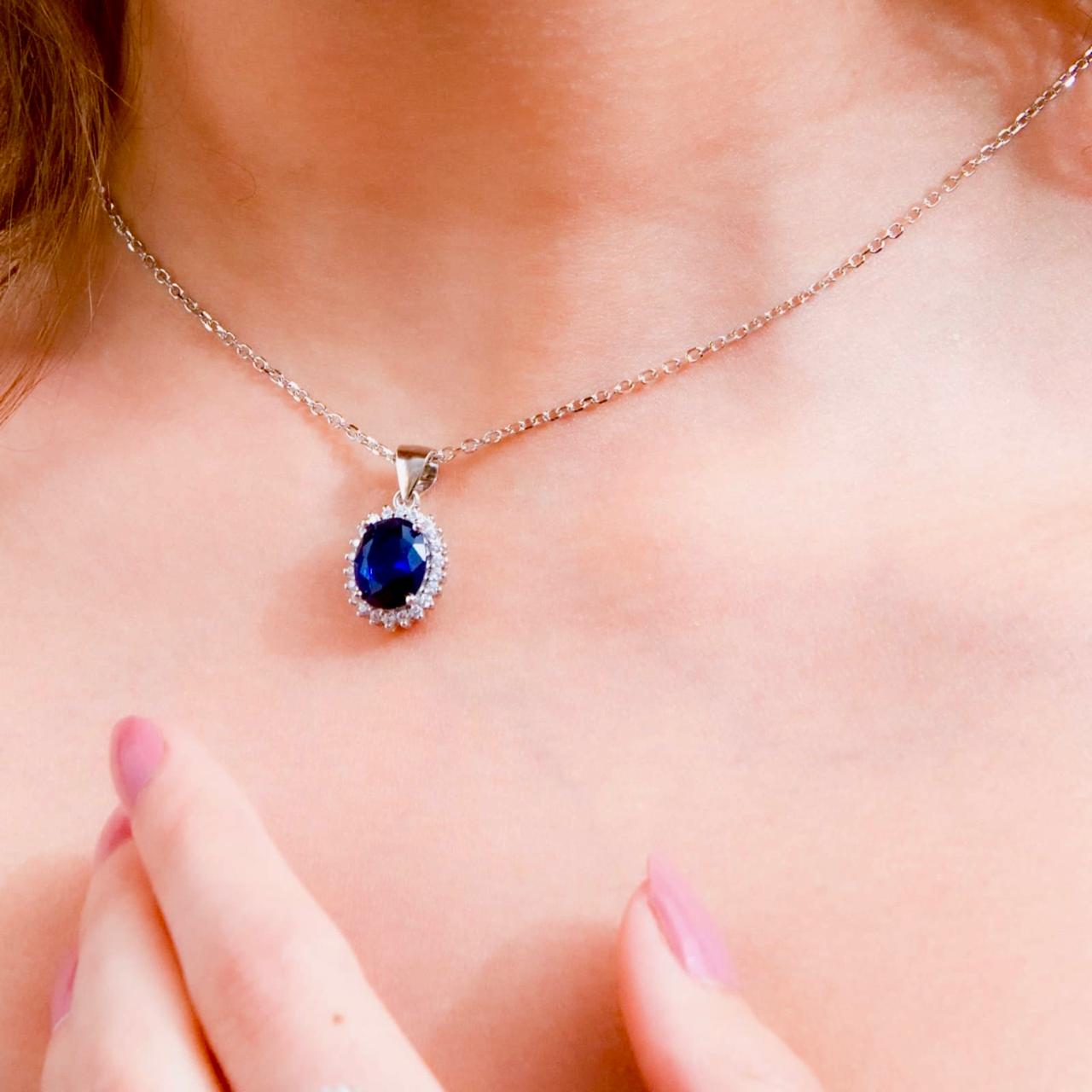 Sterling silver necklace 925, s. Oval shaped Blue Sapphire stone pendant and zirconia all lined with Zirconia frame